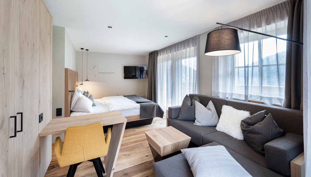 Helles und geräumiges Familienzimmer im Hotel Huber in Südtirol