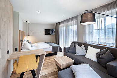 Helles und geräumiges Familienzimmer im Hotel Huber in Südtirol